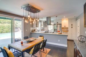 a kitchen and dining room with a table and chairs at Mid Century Modern Gem with Pool in North Tustin in La Paloma