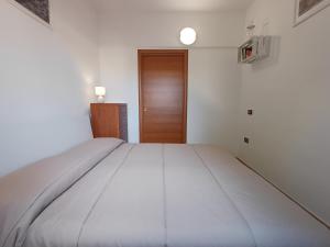 Postel nebo postele na pokoji v ubytování Domus Mare