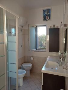 Koupelna v ubytování Domus Mare + 42 fotografií