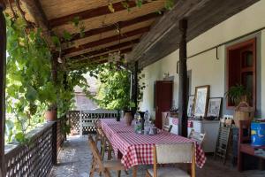 a table with a red and white checkered table cloth at Pataky Borporta in Tarcal