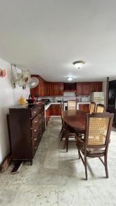 a kitchen with a table and chairs in a room at Hotel Casa Morazán in Granada