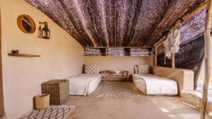 a living room with a purple ceiling and a couch at Berber Beldi Camp in Imsouane +43 photos