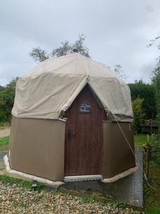a yurt with a tarp on top of it at Le dôme du Bonheur in Tourtouse +11 photos