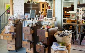a store with boxes and other items in a room at Saladin Lodge in Narbethong