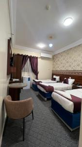 Katil atau katil-katil dalam bilik di Hayat Almansi Hotel