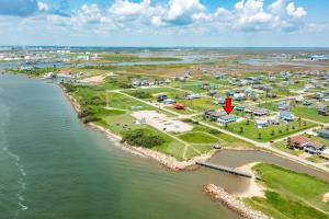 an aerial view of a resort next to the water at Across from Jetty Park and Best Ship Watching in Surfside