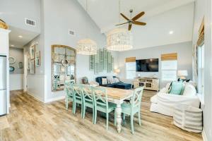 a dining room and living room with a table and chairs at Across from Jetty Park and Best Ship Watching in Surfside