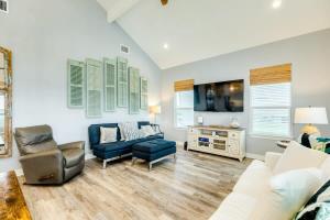 a living room with a couch and a tv at Across from Jetty Park and Best Ship Watching in Surfside +38 photos