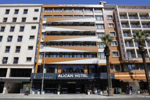 an apartment building with an american hotel at Alican 1 Hotel in Izmir