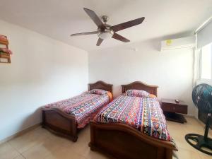 Postel nebo postele na pokoji v ubytování Colonial loft in Cartagena old town