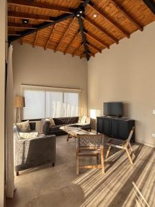 a living room with a couch and a table at Casa nueva en La Estancia de Cafayate in Cafayate