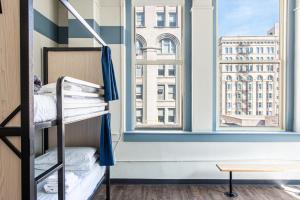 a bunk bed in a room with a window at HI Chicago Hostel in Chicago +113 photos