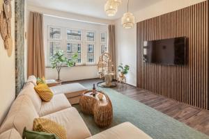 TV a/nebo společenská místnost v ubytování Imposante Whg - Zentral - Dachterrasse - Parken - Aufzug