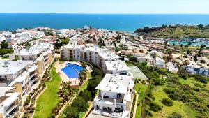 an aerial view of a city with houses and the ocean at Luxury Condo in Top Complex with Ocean and Marina View by Be Cherish in Albufeira