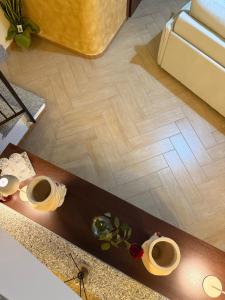an overhead view of a living room with a wood floor at Casa Marconi duplex avec terrasse in Aragona