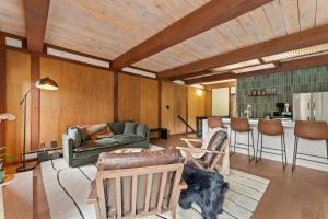 a living room with a dog laying on a rug at Charming Tahoe Cabin in Incline Village