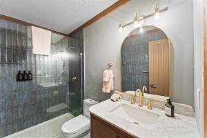 a bathroom with a sink and a toilet and a shower at Charming Tahoe Cabin in Incline Village +31 photos