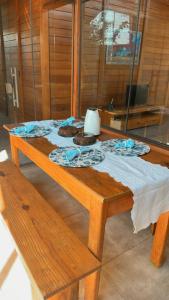 a wooden table with cookies on top of it at Chalé em meio a natureza de bonitoms in Bonito