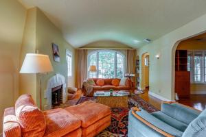 a large living room with couches and a fireplace at Extended Stay in Sacramento! Dog-Friendly Home in Oak Park