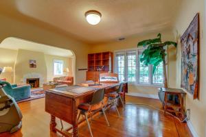 a room with a desk and chairs and a living room at Extended Stay in Sacramento! Dog-Friendly Home in Oak Park