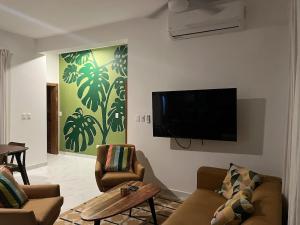 Μια τηλεόραση ή/και κέντρο ψυχαγωγίας στο Villa Tranquila - Sosua Ocean Village