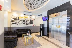 a living room with a couch and a table at JG Sohotel in New York