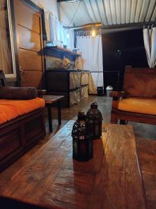 a living room with a table and a couch at Cabaña Encanto de Luna in San Francisco