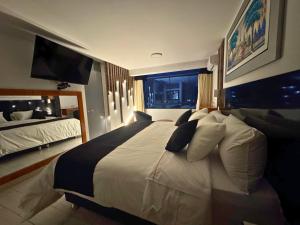 Postel nebo postele na pokoji v ubytování City Tower Hotel