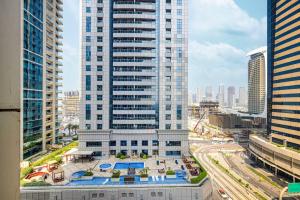 an aerial view of a city with tall buildings at StayMada - Torch Tower Elegant Marina Retreat in Dubai