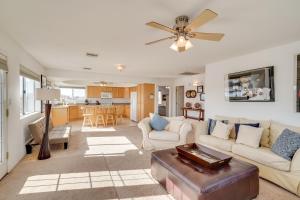 a living room with a couch and a ceiling fan at Magnificent Big River Home with Beautiful Views in Parker