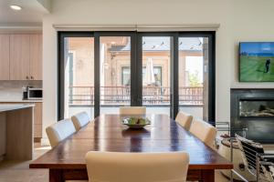 a dining room with a wooden table and chairs at The Lofts at 660 #201 in Ketchum