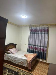 Postel nebo postele na pokoji v ubytování Central flat in the heart of Zagazig