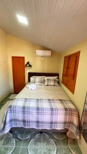 Postel nebo postele na pokoji v ubytování Suíte Nete Andrade