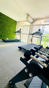 a gym with a bunch of equipment in a room at HOTEL DIANA PRINCESS in San Pedro Sula