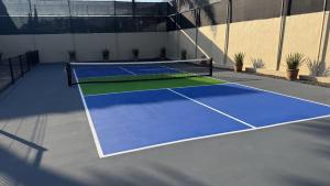 a tennis court with a net on top of it at Ajijic San Antonio Lake Chapala Villas - Pickleball Court - Gym in San Antonio