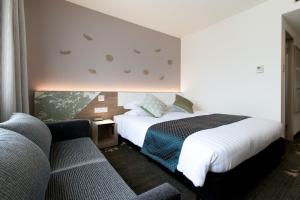 Ліжко або ліжка в номері Toyama Excel Hotel Tokyu