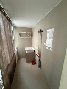 a small bathroom with a sink and a window at Alojamientos Cartagena Edificio Los Delfines in Cartagena de Indias +89 photos