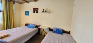 Una cama o camas en una habitación de Pacasmayo Surf Las Torres