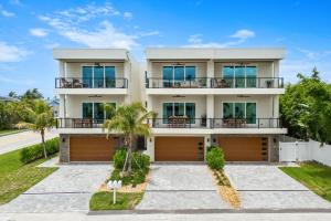 an image of a house with a driveway at 40 8th Avenue in Indialantic