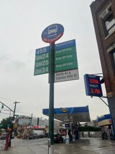 a street sign in front of a gas station at Amazing private Room in Glendale