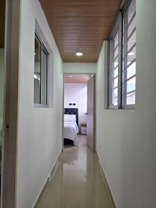 Postel nebo postele na pokoji v ubytování Hotel Penthouse Terraza cerca Cardio Infantil