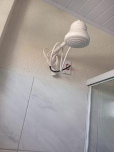 a light on the ceiling of a bathroom at A M Hotel in São Luís