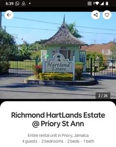 a website with a sign in front of a building at Hartland Estate Richmond Priory in Priory +1 photo