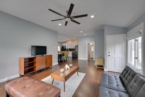 a living room with a couch and a ceiling fan at Gold Coast Getaway! Upscale Apt Near New Canaan in New Canaan