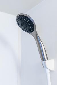 a shower head is hanging on a wall at リトリートコートキャナルシティ in Fukuoka