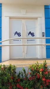 a pair of doors with dolphins on them at AS Pousada Alojamento in Sao Jose do Rio Preto