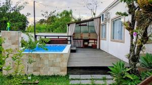 Bazén v ubytování Casa Inteira - 3 Quartos - 11 Pessoas - Piscina infantil - 200m da praia nebo v jeho okolí