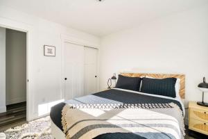 a bedroom with a large bed in a white room at Stay Portland - Brand New Luxury Mt Hood Cabin in Rhododendron