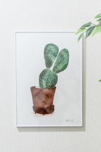 a drawing of a cactus on a white card at リトリートコートキャナルシティ in Fukuoka +65 photos