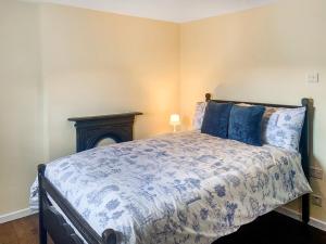 a bedroom with a bed and a fireplace at The Homestead in Leek +7 photos